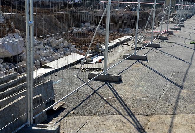 portable fence panels keeping pedestrians away from construction work zones