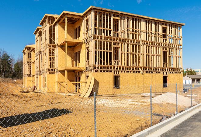 a temporary chain link fence in front of a building under construction, ensuring public safety in Fox River Grove IL